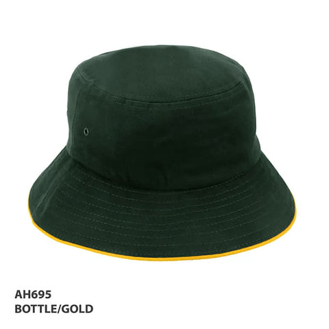 A bottle green bucket hat with a gold trim and an attached logo.